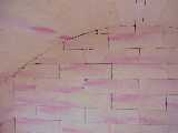 The brickwork closing back wall